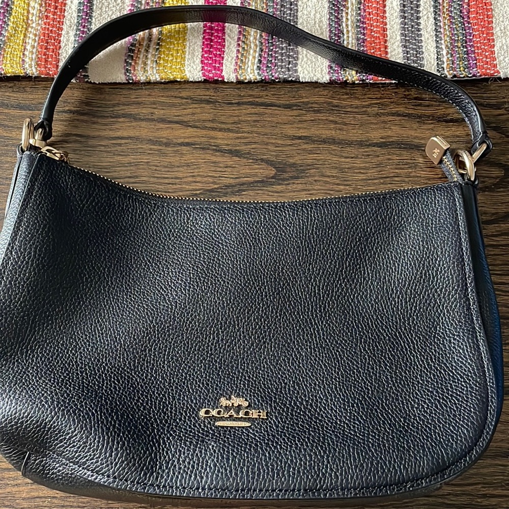 Coach purse. Never used. Black with strap.